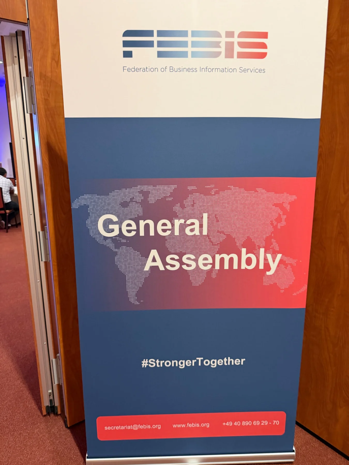 FEBIS Federation of Business Information Services General Assembly sign.