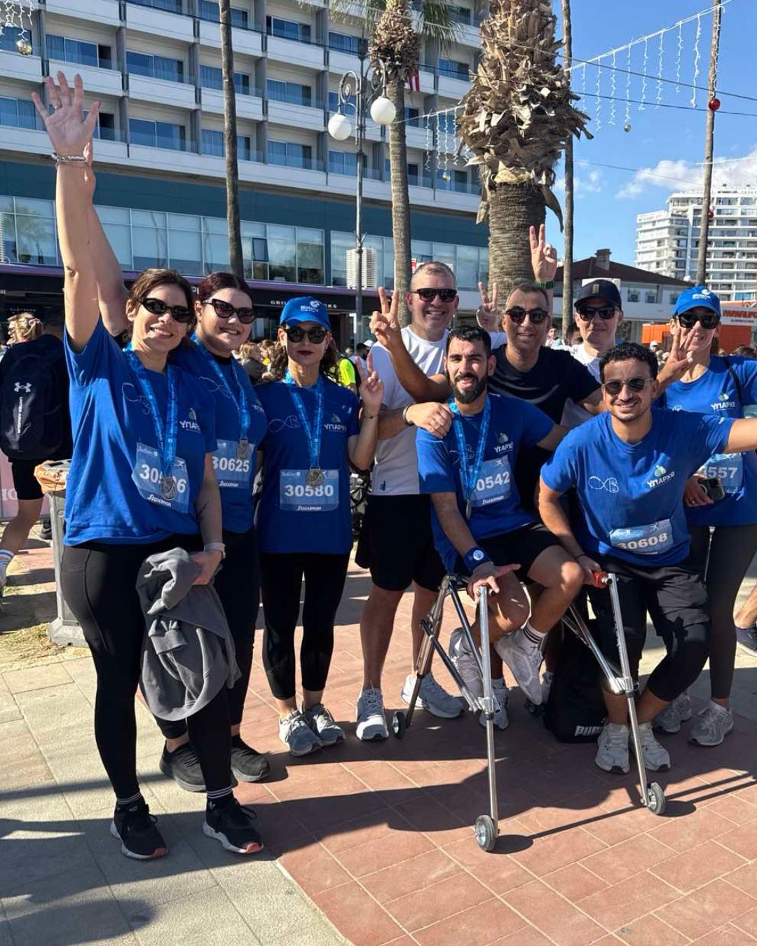 Infocredit Group team participating in the Radisson Blu International Larnaka Marathon supporting accessibility and inclusion